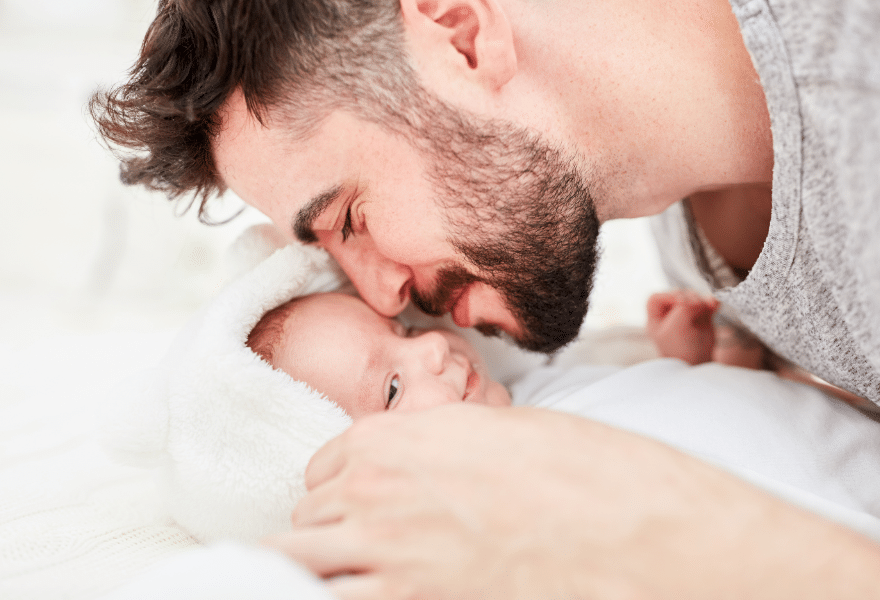 Father-Cuddles-with-His-new-born-Baby